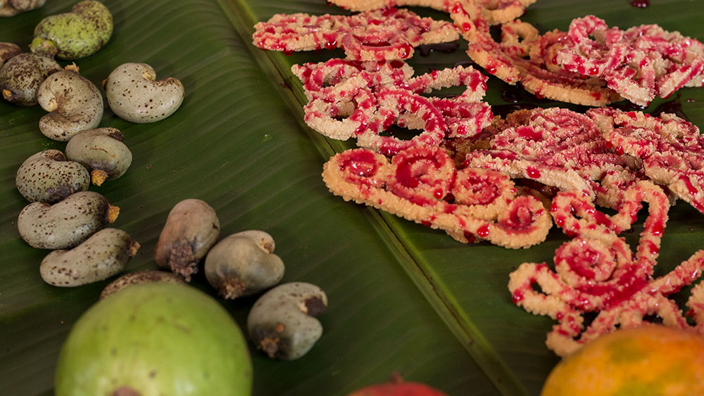 Prepared Vibara kept on a banana leaf with cashe fruits